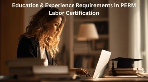 Education Requirements for PERM Labor Certification Professional working on laptop with law books, representing education gained during employment for PERM labor certification